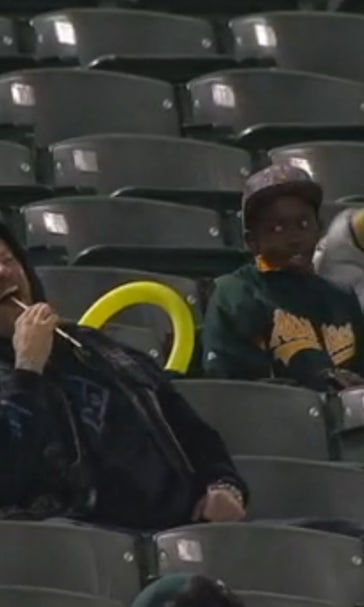 Young Oakland A's fan makes incredible catch, gives the ball to a lady